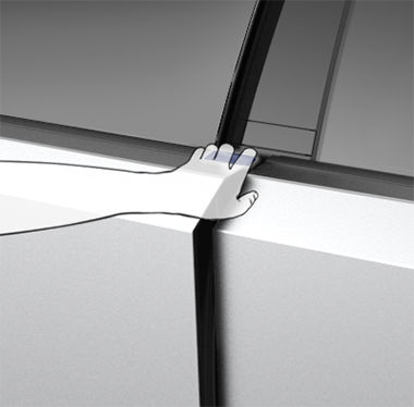 Close-up view of a hand opening the driver door by grasping the top edge, which is highlighted in blue